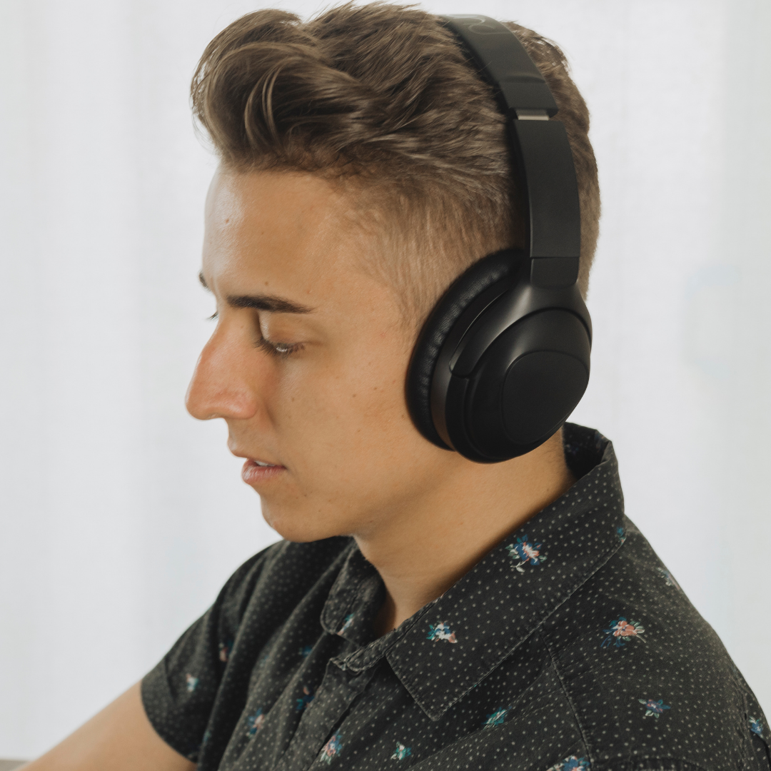Teen wearing PuroPro Headphones in Black